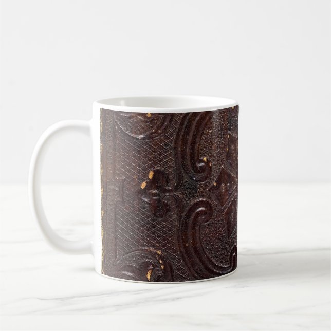 Forntida läderbok som fallit kaffemugg (Vänster)