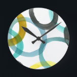 Förreglande Gult och blå cirklar Rund Klocka<br><div class="desc">En enkel utskrift av förreglande gult och blå cirklar av Megan Meagher. Med den vita bakgrunden kan färgerna på cirklarna visas.  Köp din idag!</div>