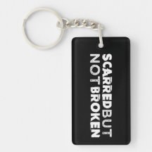 Förskräckt men inte bruten Keychain svart
