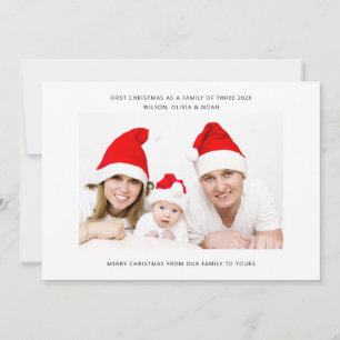 Första julen som en familj på tre familjefoto
