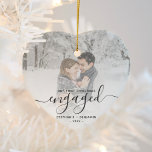 Första Julengagerad Anpassningsbar Photo Grått-skr Julgransprydnad Keramik<br><div class="desc">Minneshögtidlighålla din förlovning med denna vackra hjärtformade keepsaksdekoration. Gråttet lyder: "Vår första jul förlovad",  med ord "förlovad" i handskriftsskript i elegant med blomning före och efter. Ersätt exempelbilden med ditt favoritfoto och lägg till namnen och året. Ett vitt övertoningsfilter hjälper till att göra så att texten visas.</div>