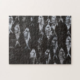 Fossil White Fish on Black Background Pussel