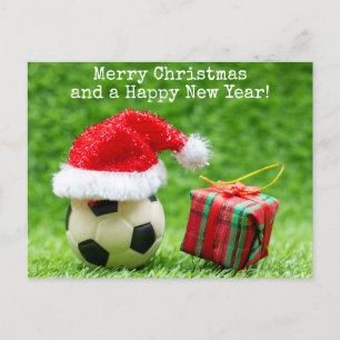 Fotboll med julhatt och julklapp vykort