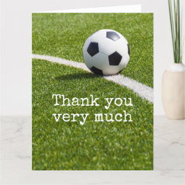 Fotboll med ord Tack på grönt gräs