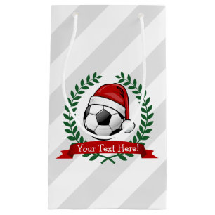 Fotbollboll som ha på sig jul för en Santa hatt