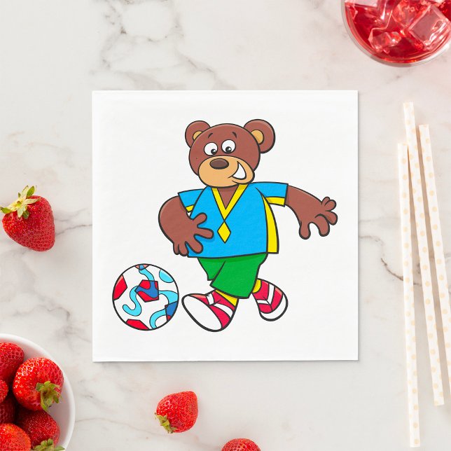 Fotbollsbjörn som spelar fotboll i sportkläder  pappersservett (Skapare uppladdad)
