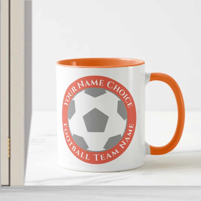 Fotbollsklubbsdesign i orange mugg (Skapare uppladdad)