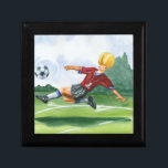 Fotbollsspelare Kicking a Boll av Jay Throckmorton Smyckeskrin<br><div class="desc">En fotboll hänger i luft och väntar på den onda spark som spelaren håller på att ge. Kan han böja det som Beckham? Ett underbart biet att hänga på din mur eller ge som en gåva till fotbollens aficionado i ditt liv!</div>
