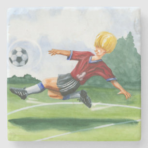 Fotbollsspelare Kicking a Boll av Jay Throckmorton Stenunderlägg