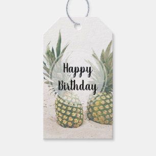 Foto av 2 ananas på en hönsdag presentetikett