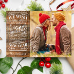 Foto för God jul-typografi för Rustic Wood Julkort<br><div class="desc">Sprid lite helgdag munkavle med detta kort med en rustisk typografi som lyder: "Vi önskar dig ett God jul och ett Gott nytt år" mot en fin träplank. Lägg till foto och namn för att skapa ett unikt helgdag-kort. Perfekt för nyfödda, familjer och bara för alla som har ett mer...</div>