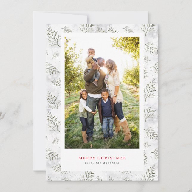 Foto i grön och vit ram med text omgiven av snö oc julkort (Framsida)