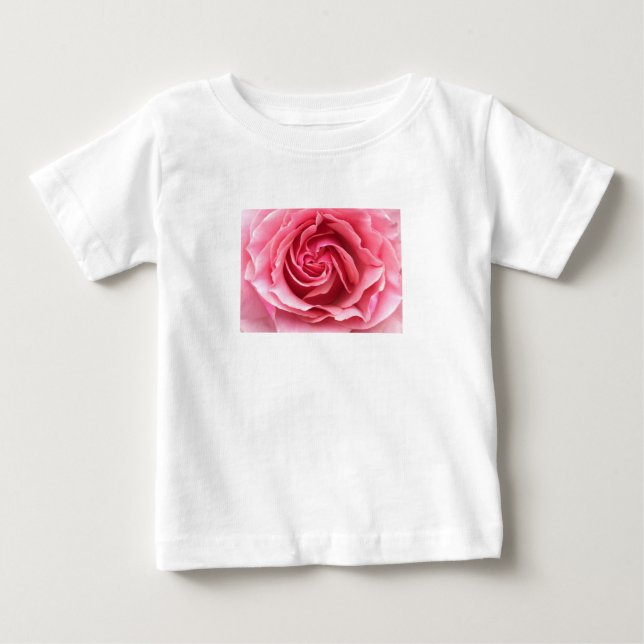 Fotografera av rosa ros på barnets t-shirt. tee shirt (Framsida)