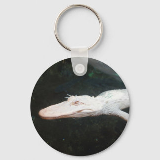 Fotografi av Swimming albino alligator färg Nyckelring