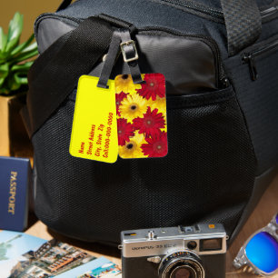 Fotografi över rött och Gult Gerber Daisy Bagagebricka