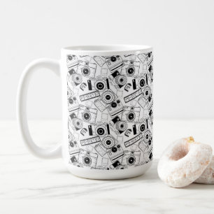 Fotografikameror i svartvitt kaffemugg