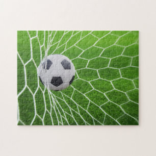 Fotopussel med fotboll och nätfoto