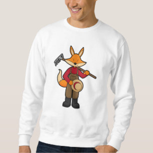 Fox som odlare med kummel och hatt lång ärmad tröja