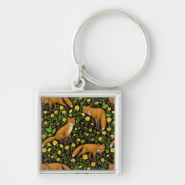 Foxar och butterkuggar på svart fyrkantig silverfärgad nyckelring (Framsidan)