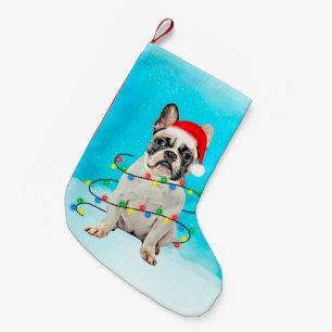 Fransk bulldogg i ljus för snöjulSanta hatt Liten Julstrumpa