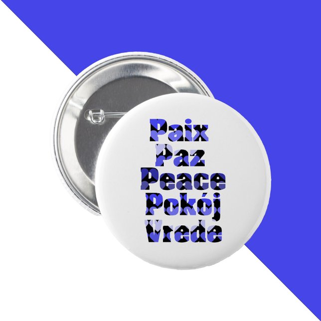 Fred Många Språk Hjärtan Blå Knapp (A pin back button that says peace in a variety of foreign languages with blue hearts.)