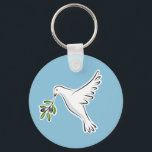 Fredduva med oliv gren nyckelring<br><div class="desc">En vacker vit duva som bär en oliv gren på blå bakgrund. En klassisk symbol för fred.</div>