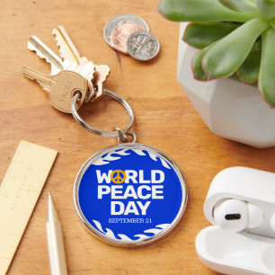 Fredsteckenet Blue Orange World Peace Day Rund Silverfärgad Nyckelring