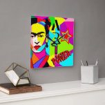 Frida POP ART Fyrkantig Klocka<br><div class="desc">"Frida Lives" med en färgstark popkonst porträtt i Frida Kahlo - Square Wall Clock,  POP ART stil genom O.M-design</div>