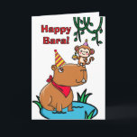 Friend Birthday Capybara och Monkey Kort<br><div class="desc">Bara lycklig! Ett kort för hälsning av en vän med en illustration av en kapybara och en apa som håller en cupkaka på näsan. Capy Birthday till en söt och rolig vän,  skriven inuti. Art,  bild och versell copyright © Shoaff Ballanger Studios,  2025.</div>
