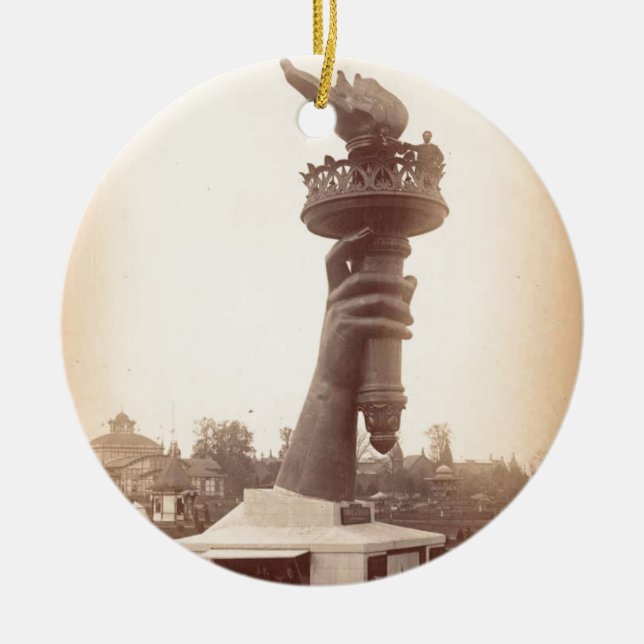frihetsgudinnan hand och fack 1886 julgransprydnad keramik (Framsidan)
