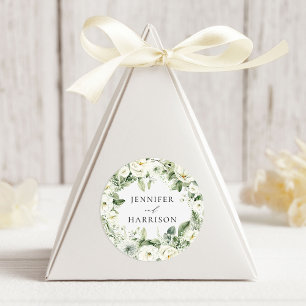 Frodiga vita blommor och grönska krans bröllop runt klistermärke