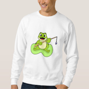 Frog vid fiske med fiskstav lång ärmad tröja