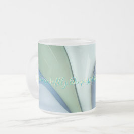 Frostad glas mugg i stilren grafik