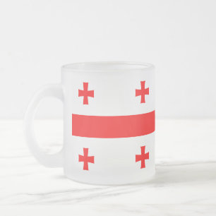 Fryst, litet glas mugg med flagga från Georgien