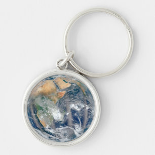 Fullt jorden som visar Östran Hemisphere. Rund Silverfärgad Nyckelring