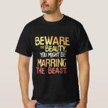 Funny Bachelor Party T-Shirt<br><div class="desc">Tittar efter en skjorta som säger vad alla tänker på bröllopsmottagningen? Titta inte längre! Det här superskojet "Var försiktig med skönheten, du kanske ska gifta dig med Beasten" är perfekt för make att vara skeptiska vänner, eller någon med vass känsla för humor. Med djärv typografi som fångar öga och ett...</div>