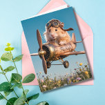 Funny Birthday Hamster Pilot & Aviator Aviator Kort<br><div class="desc">Lustigt födelsedagskort med ett foto av hamster med hjälm och glasögon som flyger ett vintage flygplan över ett fält av vilda blommor. Inuti är det roligt att föda önskemål. Perfekt för en djurälskare, pilot- eller flygentusiaster. Anpassa den med din egen födelsedag önskemål för att göra extra speciellt. Upphovsrätten kommer snart...</div>