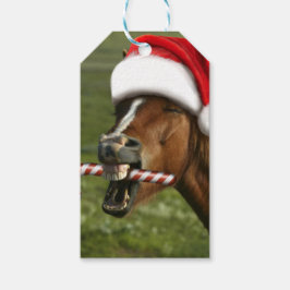 Funny Christmas horse with Santa hat smiling Presentetikett