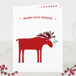 Funny Moose Helgkort<br><div class="desc">Merry Kiss Moose,  rosa och vit julkort med en vit helgdag med en viskös mosa eller älk med en massa mistletoe bunden till sin antler,  i hopp om en kylig kyss. Ändra eller ta bort meddelandet och lägg till din familj namn i hälsning inuti för att anpassa.</div>