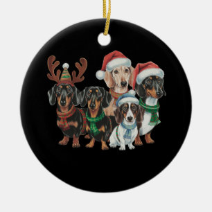 Fyra Dachshundhundar iklädda festlig klänning Julgransprydnad Keramik
