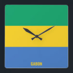 Gabon National Flagga Patriotic Fyrkantig Klocka<br><div class="desc">Gabons nationella Flagga Patriotic Square Wall Clock med flagga land i färg tryckt över hela tiden. Land namn är delvis integrerat i utformningen på grund. Anpassadet Text är fullt ut med funktionen "Anpassa den!". Den här charmerande utformningen är den häpnadsväckande presenten och den underbara show biet på väggen. © 2022...</div>