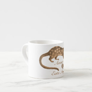 Galna australiensiska Quoll äter något den Aussi Espressomugg