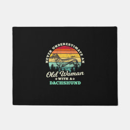 Gamla kvinnor med doachshund