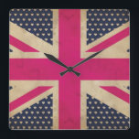 Gamla Rosans Jack Flagga Wall Clock Fyrkantig Klocka<br><div class="desc">En illustrerad grafisk design av en gammal Union Jack Flagga i skuggor av rosa och vitt mot bakgrund färg av mörk blått med vita hjärtan som passar för alla azzelprodukter.</div>