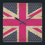 Gamla Rosans Jack Flagga Wall Clock Fyrkantig Klocka<br><div class="desc">En illustrerad grafisk design av en gammal Union Jack Flagga i skuggor av rosa och vitt mot bakgrund färg av mörk blått med vita hjärtan som passar för alla azzelprodukter.</div>