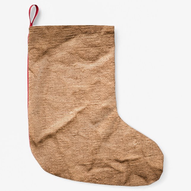 Gammal brun trasa-bakgrund liten julstrumpa (Framsidan)