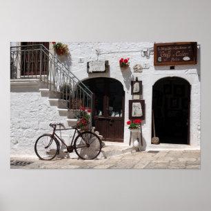 Gammal cykel och skyltfönster i Apulia Poster