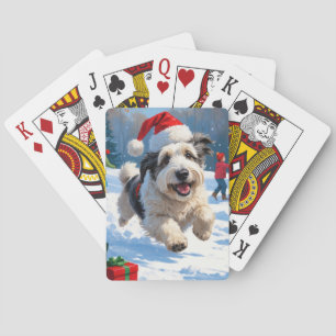 Gammal engelsk herdehund springer i snö julhatt casinokort