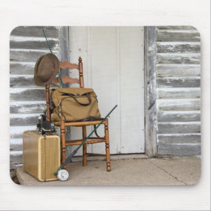 Gammal fiskeriutrustning på stol musmatta