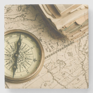 Gammal kompass över forntida karta underlägg sten